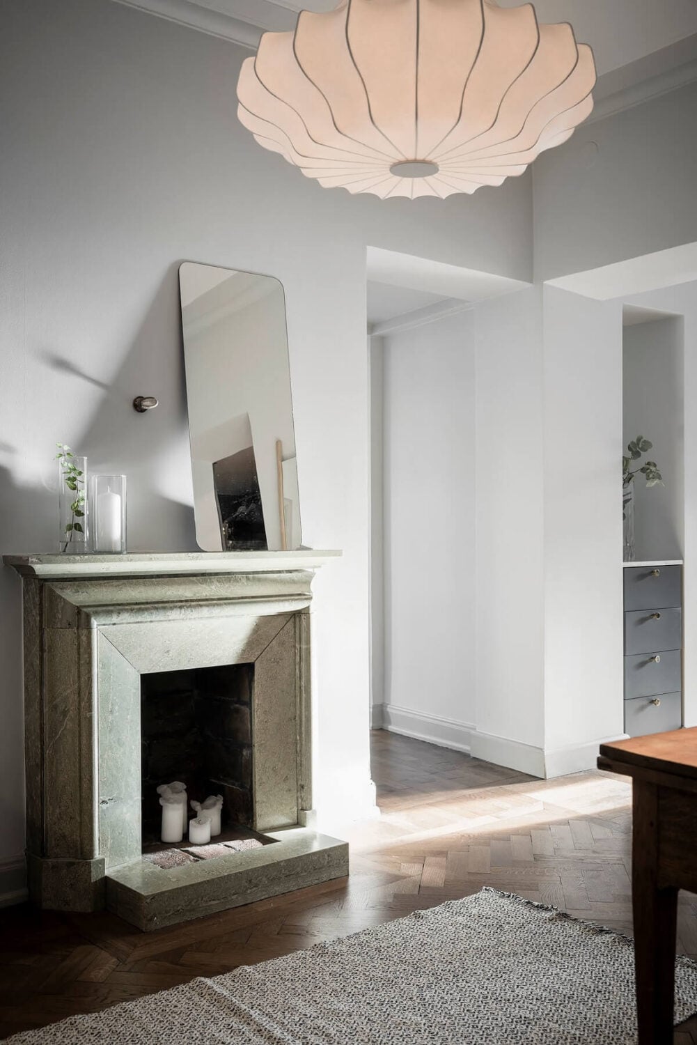 A Burgundy Kitchen in a Stylish Scandinavian Apartment 27 hallway with fireplace