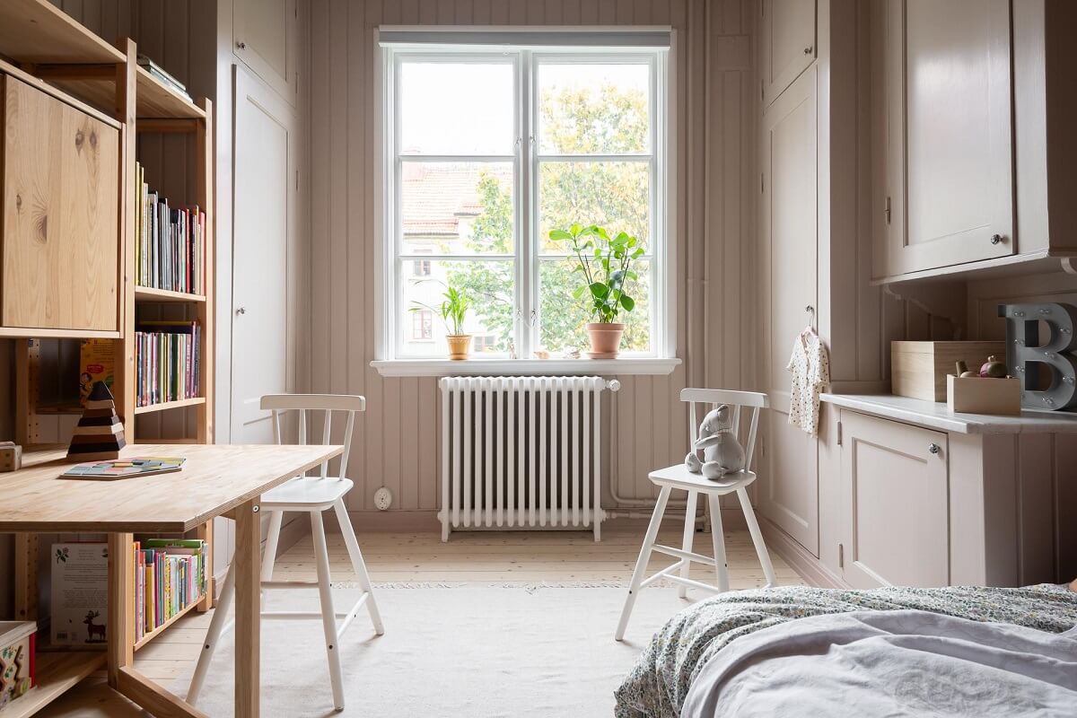 A Swedish Apartment Painted in Calm Beige, Green, and Pink Tones 22 ikea ivar cabinet desk kids bedroom