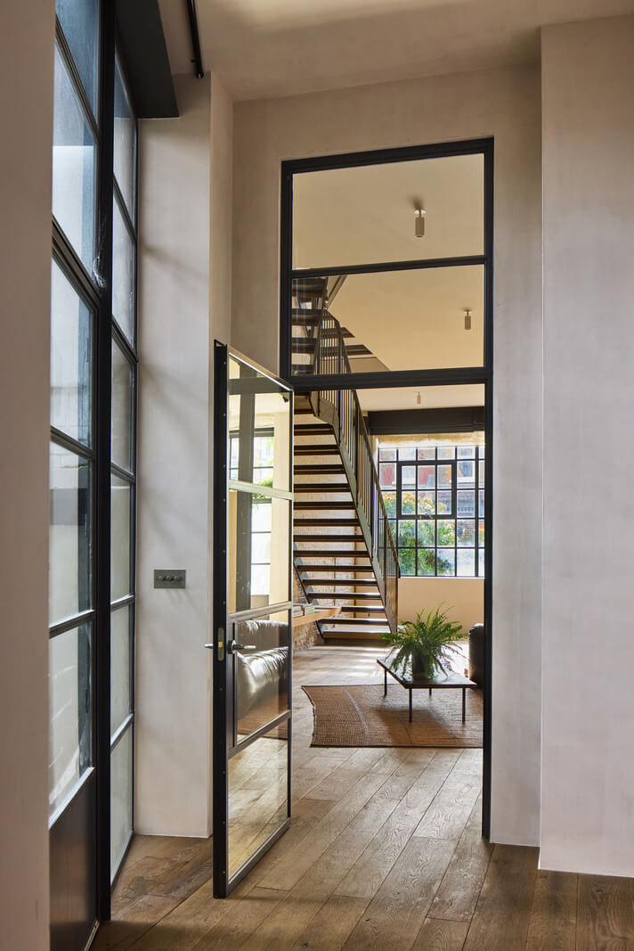 A Grand Industrial Warehouse Conversion in London 12 industrial glass door