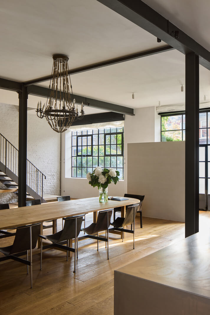 A Grand Industrial Warehouse Conversion in London 7 industrial style kitchen with large dining table