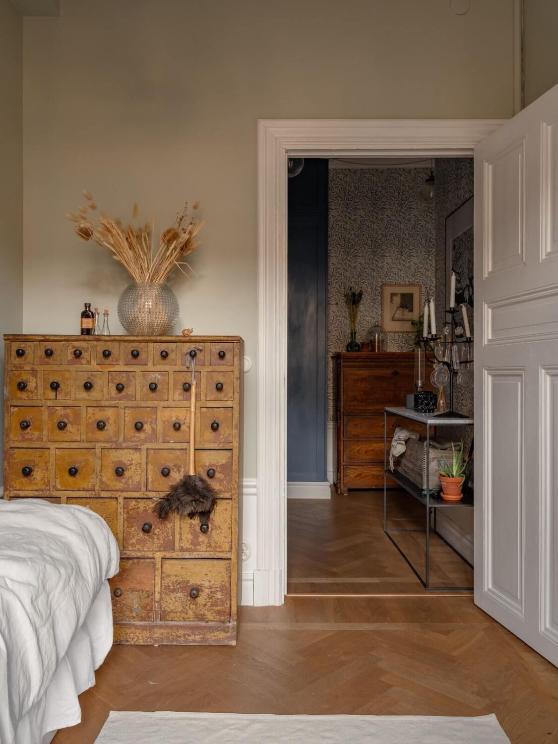 An 1890s Stockholm Apartment with a Blue Bedroom 17 kids bedroom with wooden cabinet and light gray walls