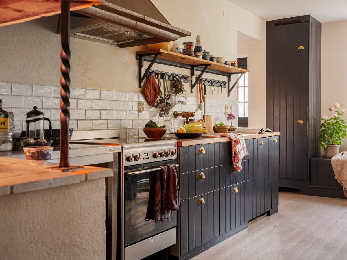 A Bohemian-Style House on the Estate of a Swedish Castle 9 kitchen blue cabinets