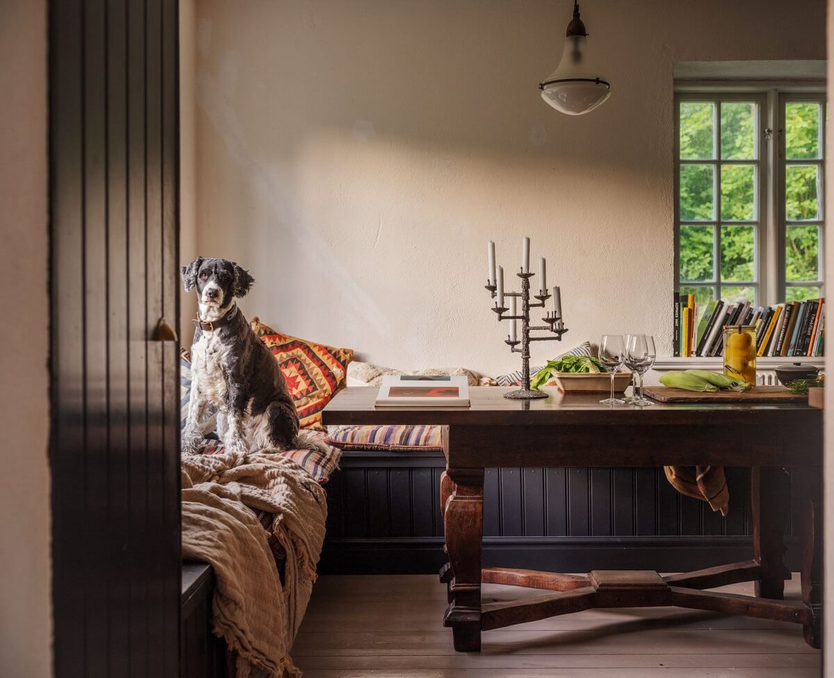 A Bohemian-Style House on the Estate of a Swedish Castle 7 kitchen built in seating wooden table