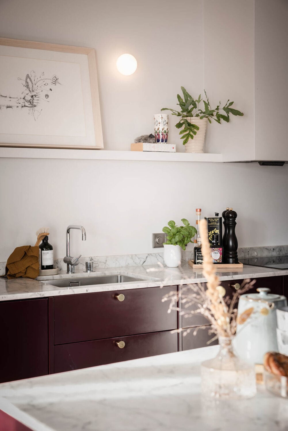 A Burgundy Kitchen in a Stylish Scandinavian Apartment 16 kitchen detail