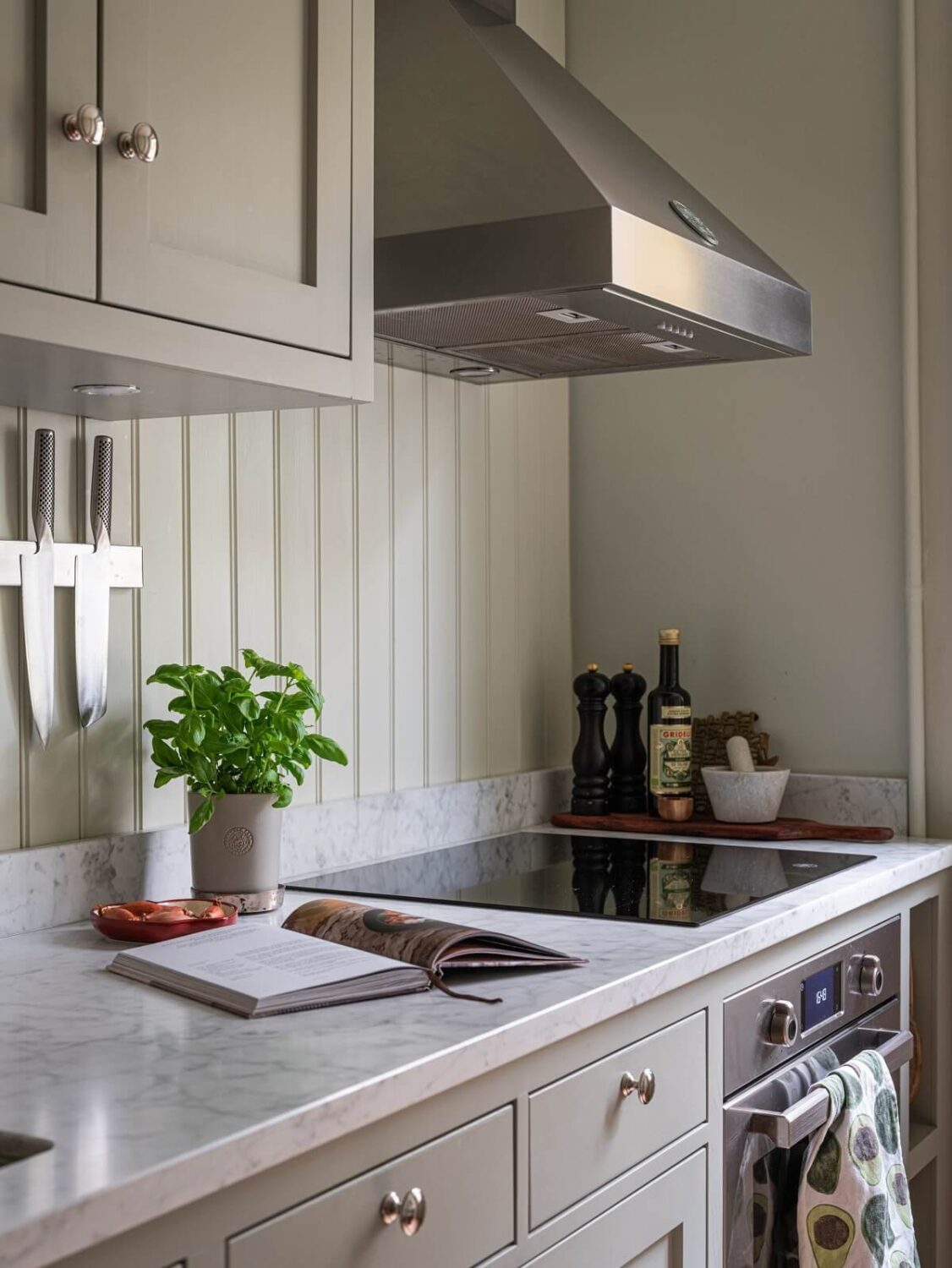 A 1930s Apartment with Gray Rooms and Period Features 9 kitchen detail gray cabines and walls