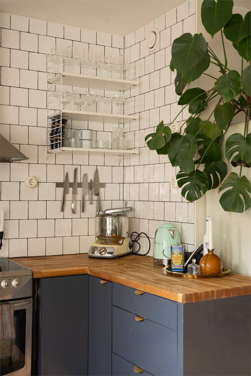 Green Tones in a Turn-of-the-Century Stockholm Apartment 6 kitchen detail white tiles