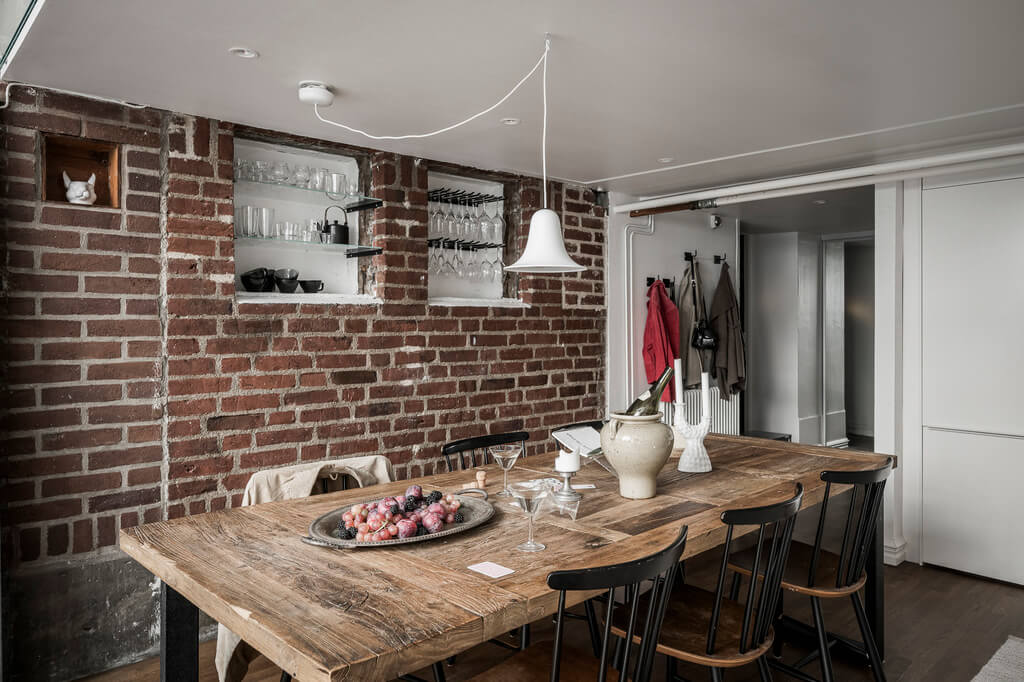 A Scandinavian Loft in an Old Industrial Building 12 kitchen dining table andbrick wall