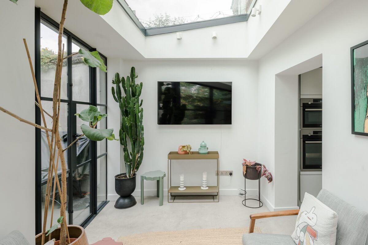 A Bright Extended and Renovated Victorian House in London 7 kitchen extension sitting room with large skylight