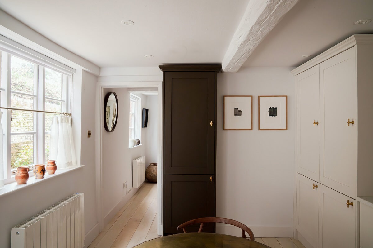 Contemporary Light Interiors in a 19th-Century English Cottage 12 kitchen floor to ceiling cabinet
