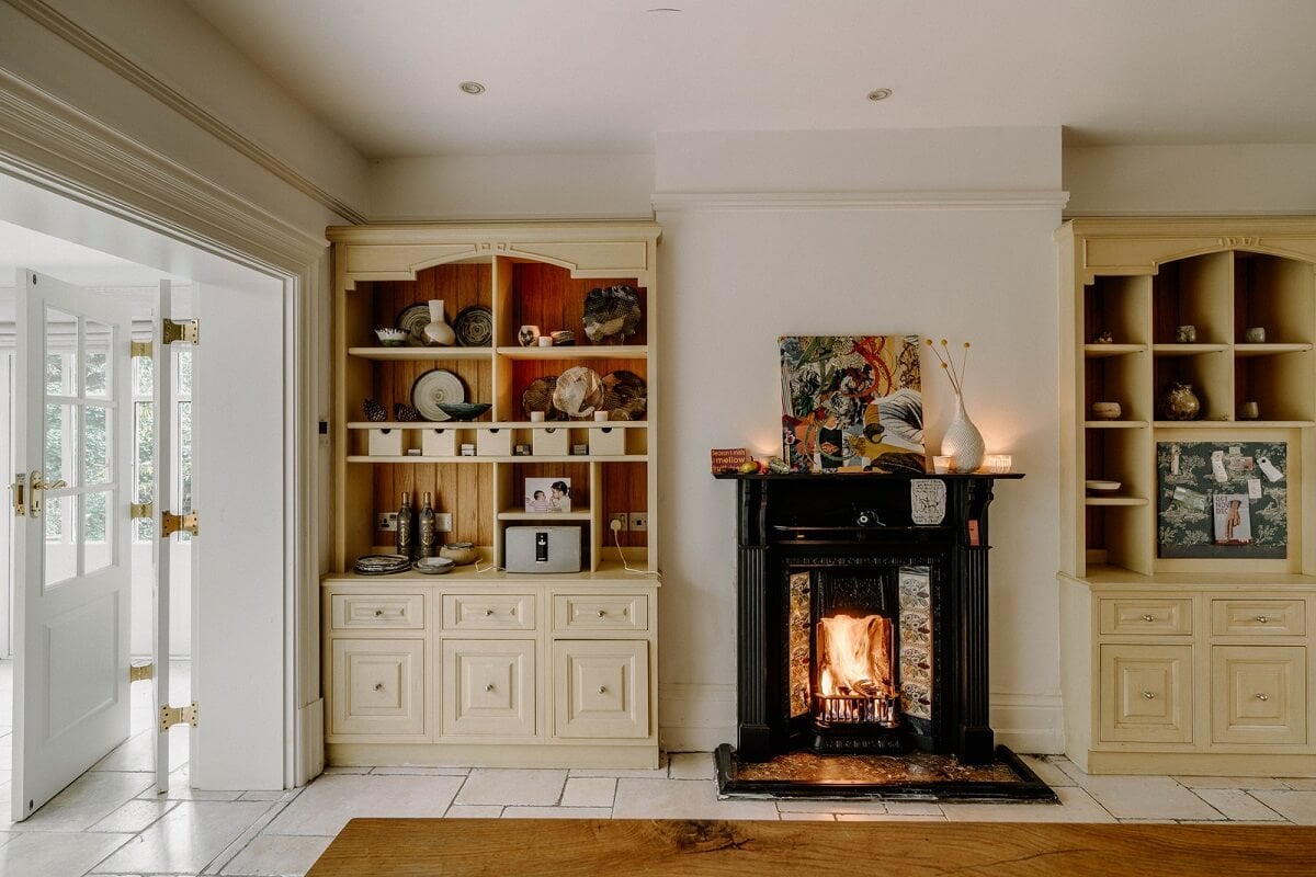 A Grand Arts and Crafts House in London 7 kitchen light yellow cabinets fireplace