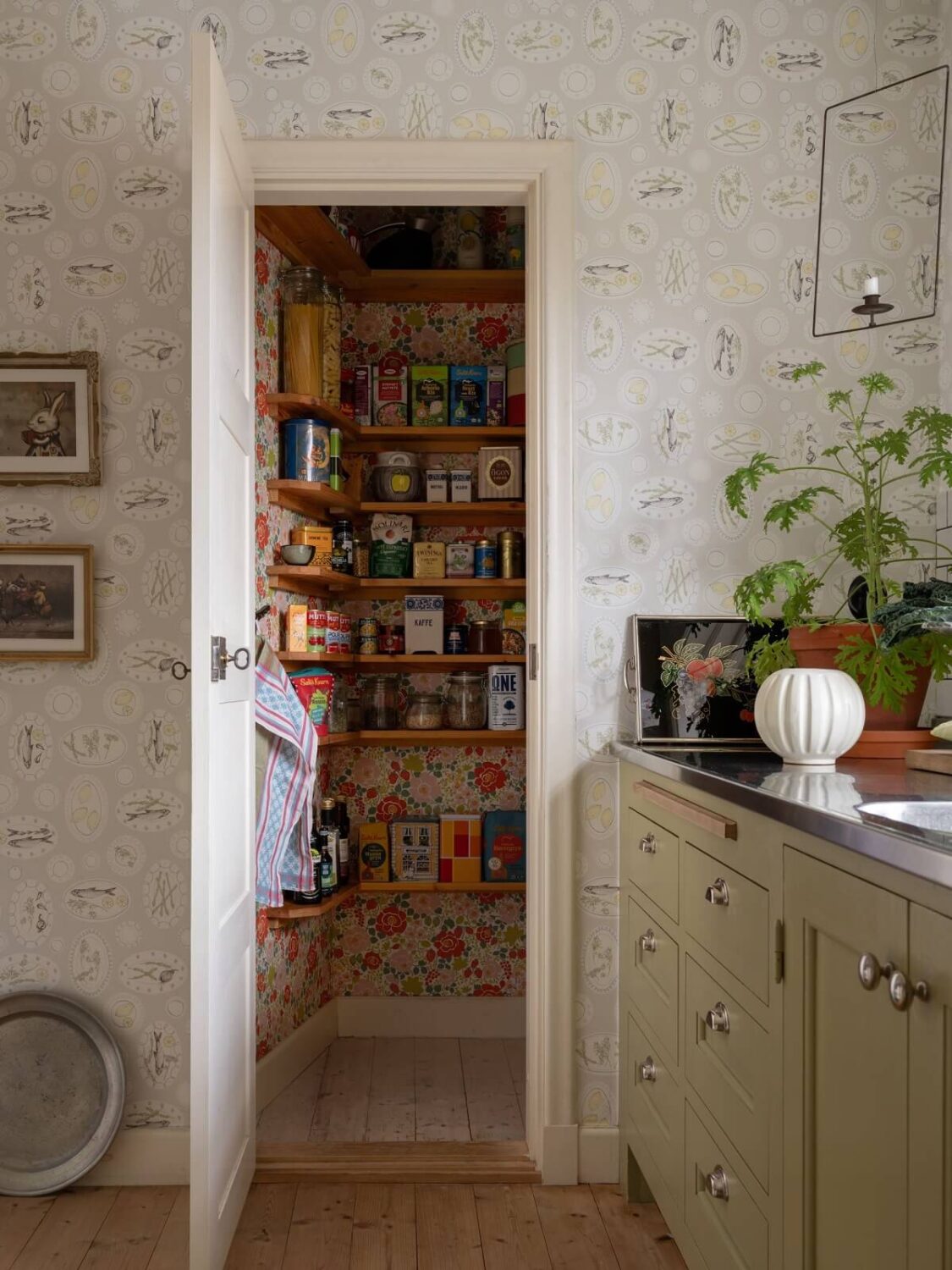 A 1930s Green-Painted Wooden Family Home in Sweden 4 kitchen pantry with colorful wallpaper