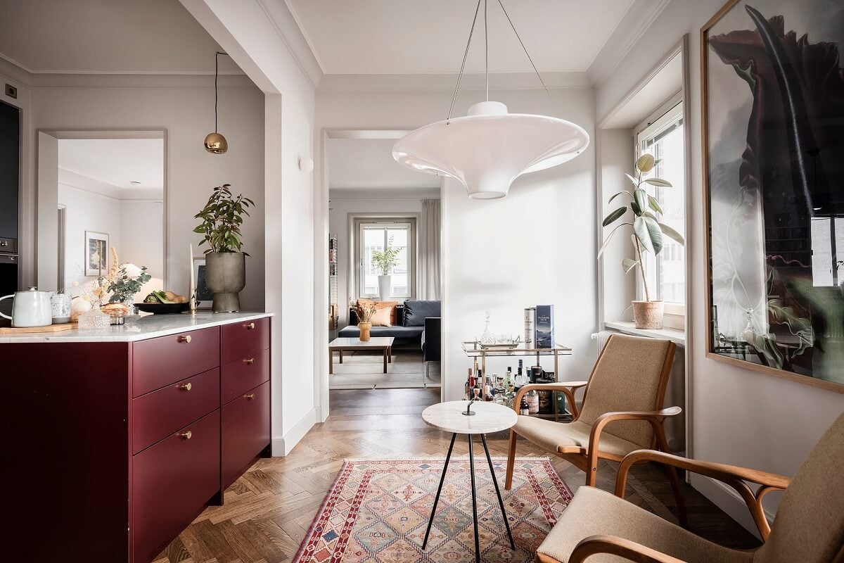 A Burgundy Kitchen in a Stylish Scandinavian Apartment 18 kitchen pink cabinets and seating