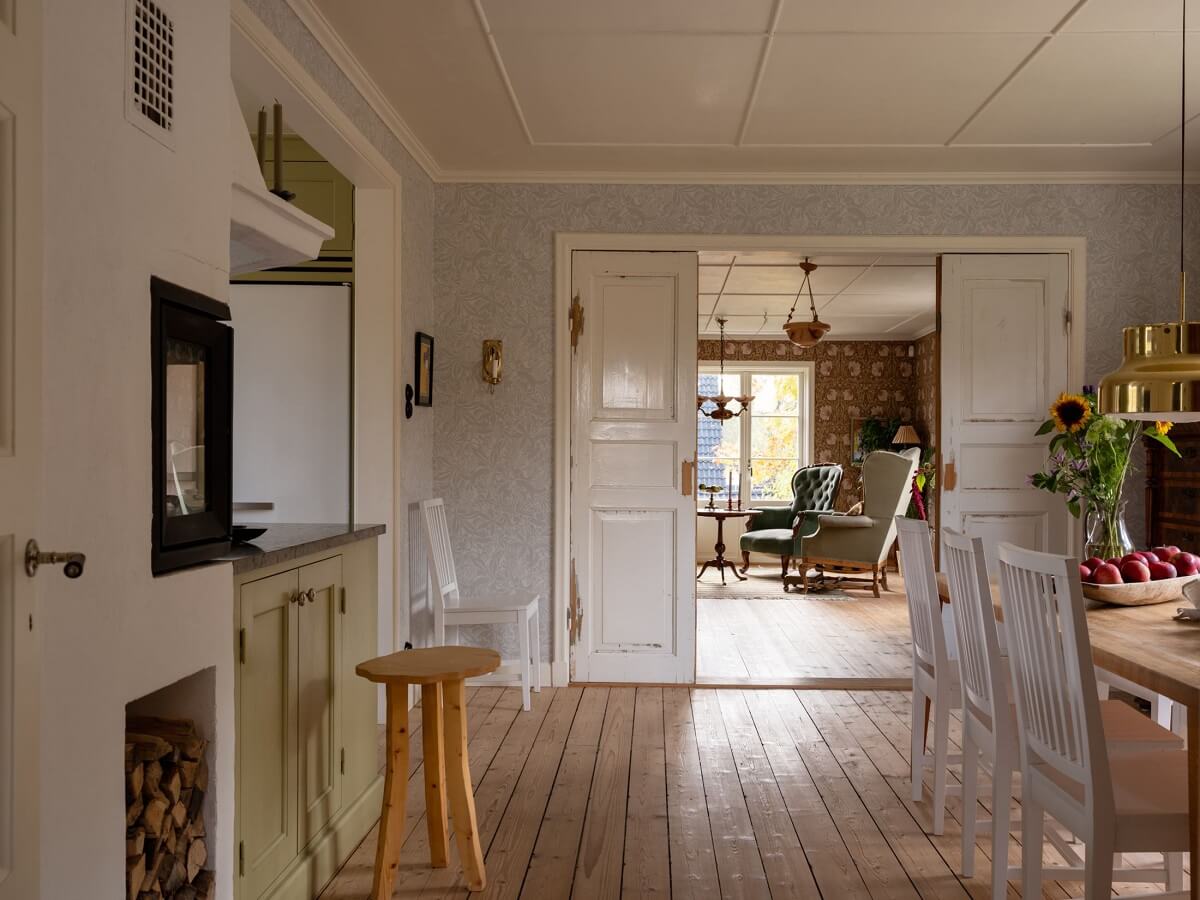 A 1930s Green-Painted Wooden Family Home in Sweden 7 kitchen space and double wooden doors