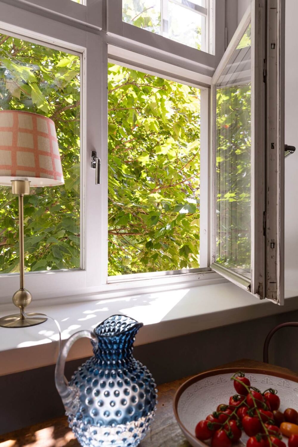 Soft Colors in a Charming Corner Apartment in Stockholm 19 kitchen window