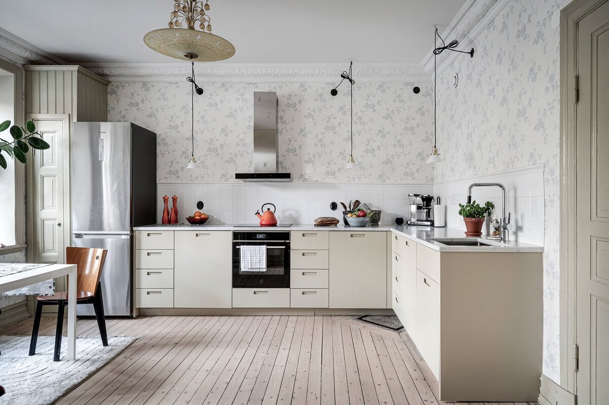 A Stately Apartment with Period Details and Wallpapers 7 kitchen with light gray cabinet and light blue wallpaper