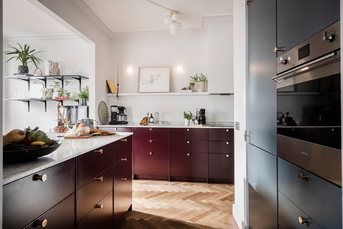 A Burgundy Kitchen in a Stylish Scandinavian Apartment 12 kitchen with pink and blue cabinets