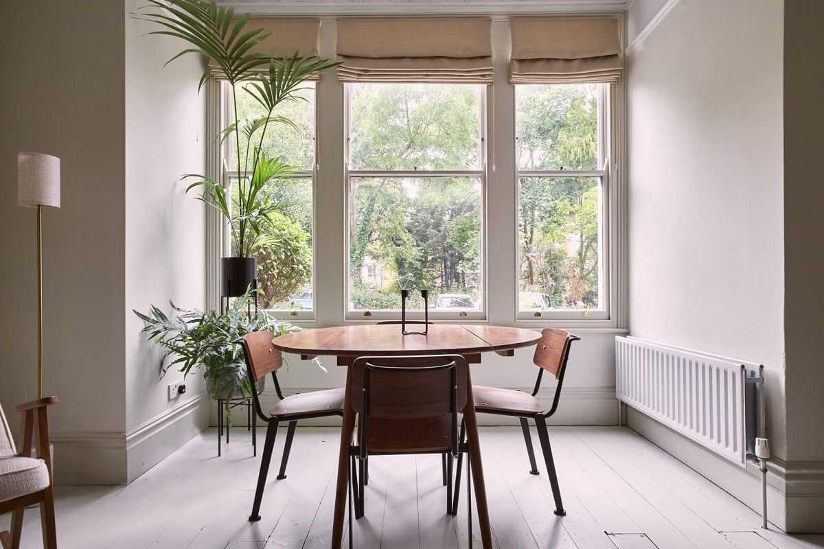 A Grand Victorian House with Many Period Features and a Lush Garden 3 large bay window round table