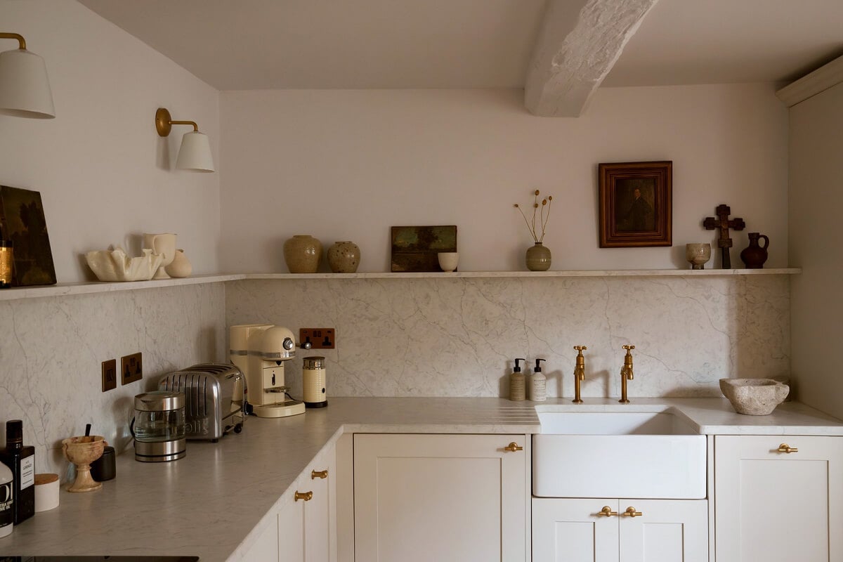 Contemporary Light Interiors in a 19th-Century English Cottage 8 light corner kitchen butler sink brass fittings shelf