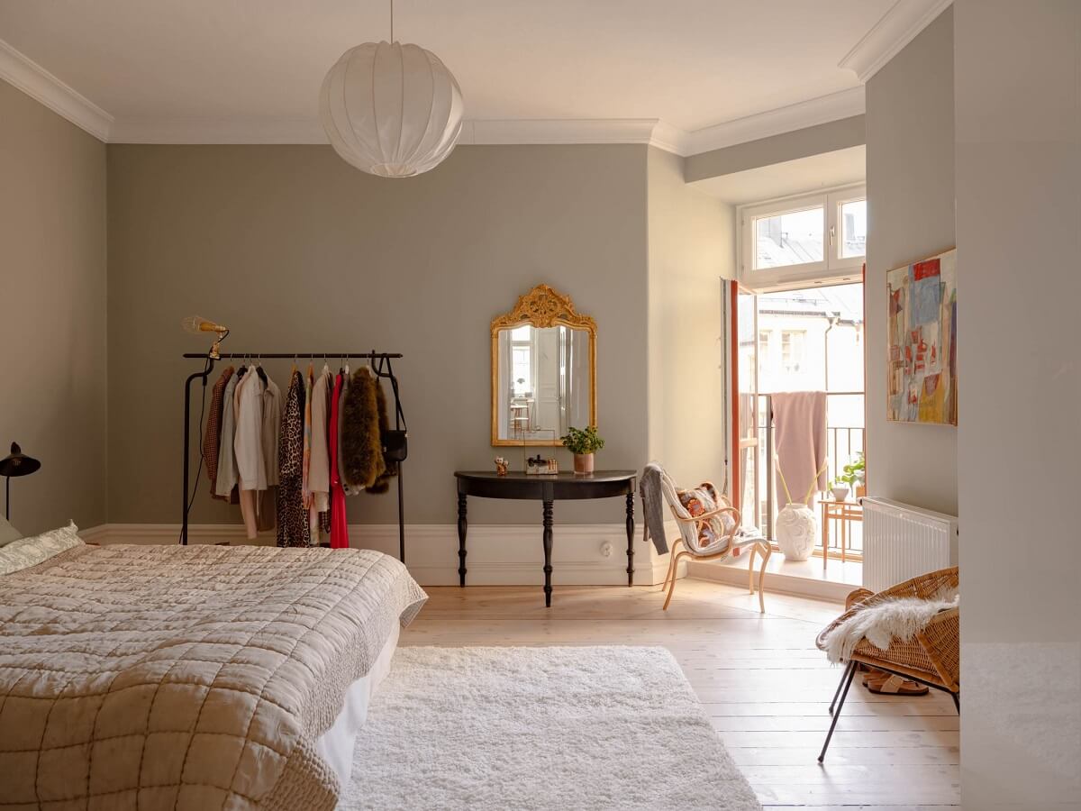 A Spacious Stockholm Apartment with Light Gray Walls 16 light gray bedroom with clothing rack
