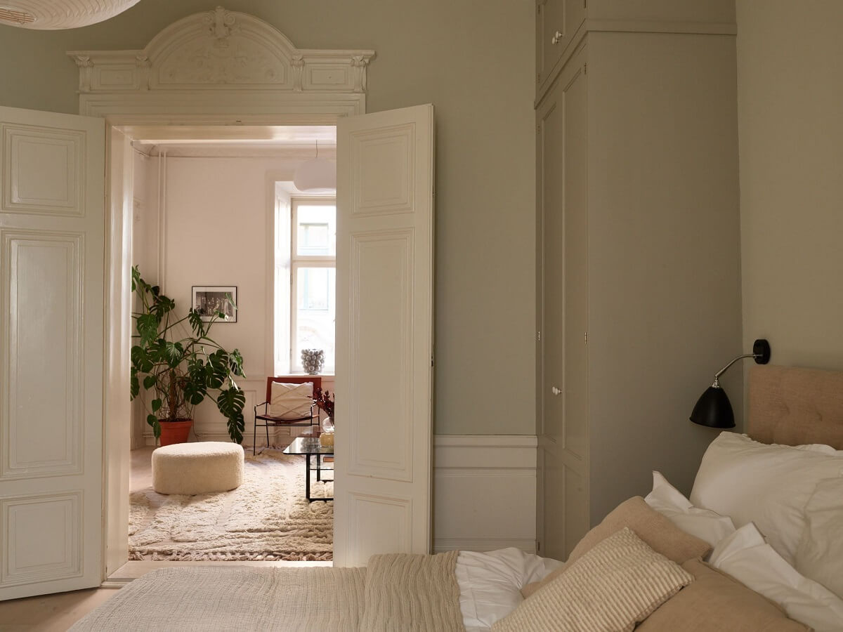 A Light Corner Apartment with 1890s Period Features 21 light gray bedroom with double doors
