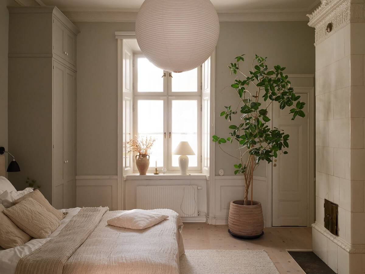 A Light Corner Apartment with 1890s Period Features 17 light gray bedroom with fireplace