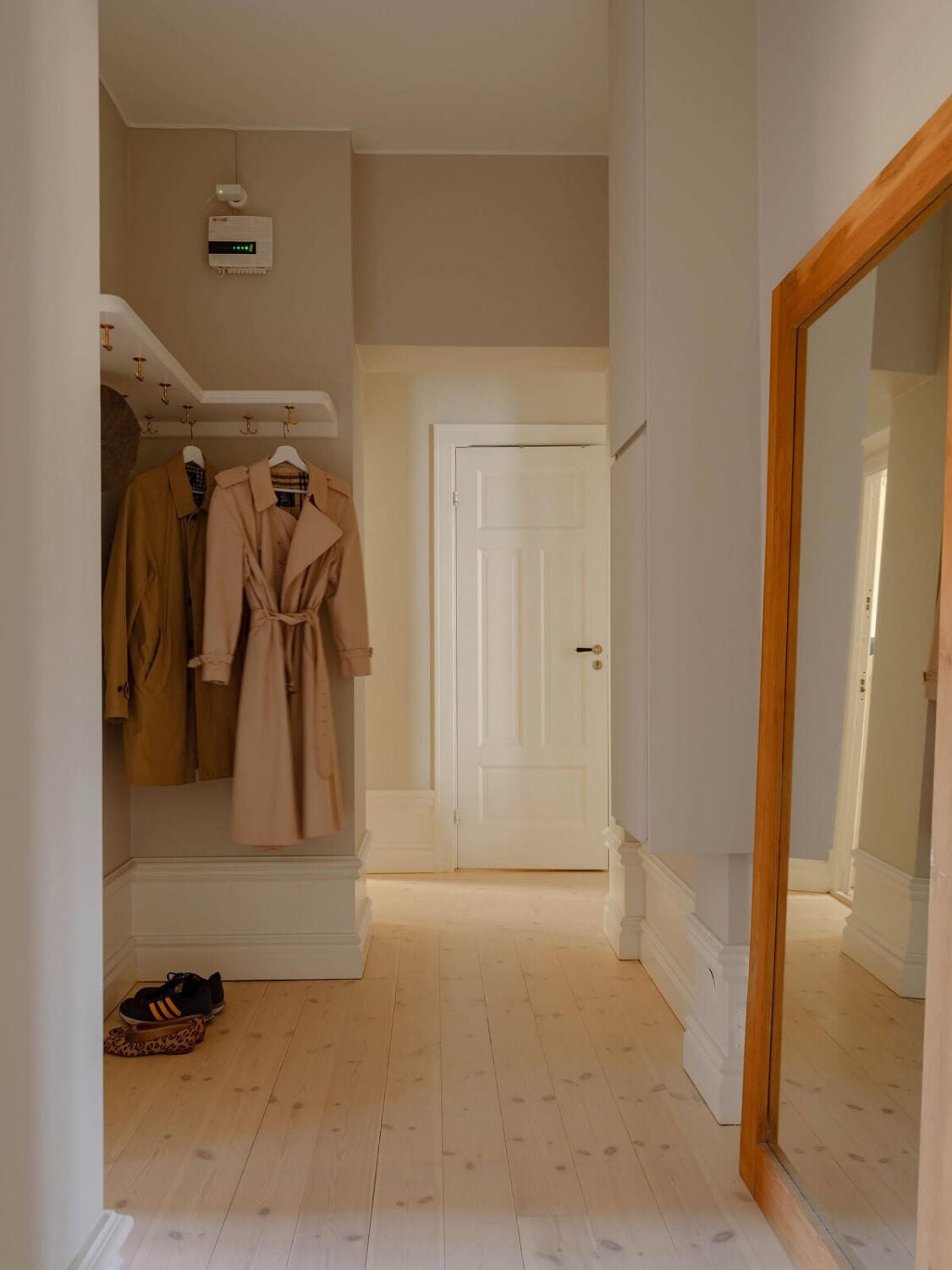 A Spacious Stockholm Apartment with Light Gray Walls 22 light gray hallway wooden floor
