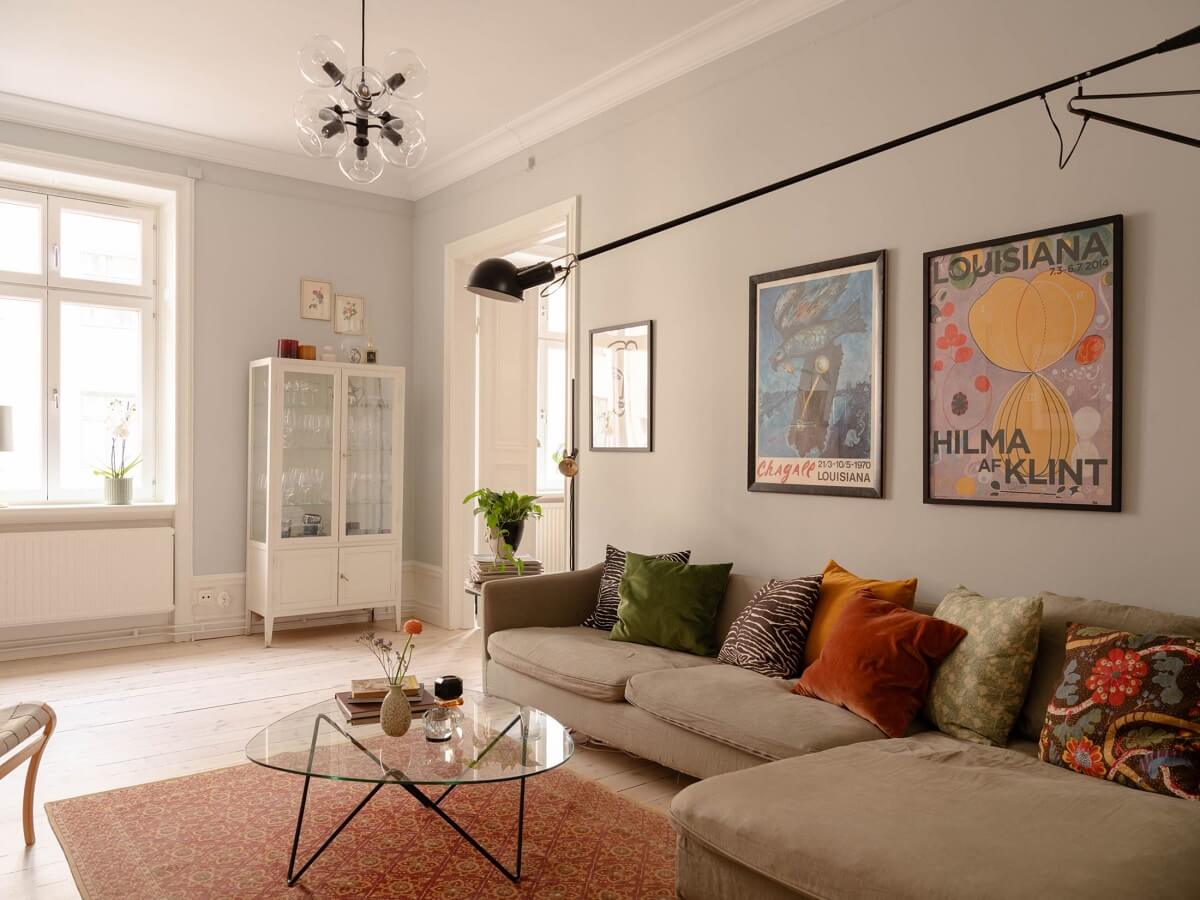 A Spacious Stockholm Apartment with Light Gray Walls 3 light gray living room tall wall light