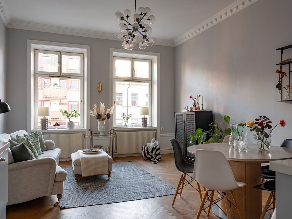 An 1890s Stockholm Apartment with a Blue Bedroom 1 light gray living room with period features