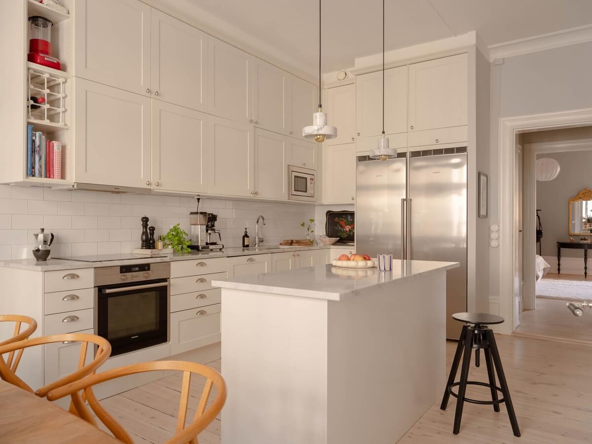 A Spacious Stockholm Apartment with Light Gray Walls 13 light kitchen with island