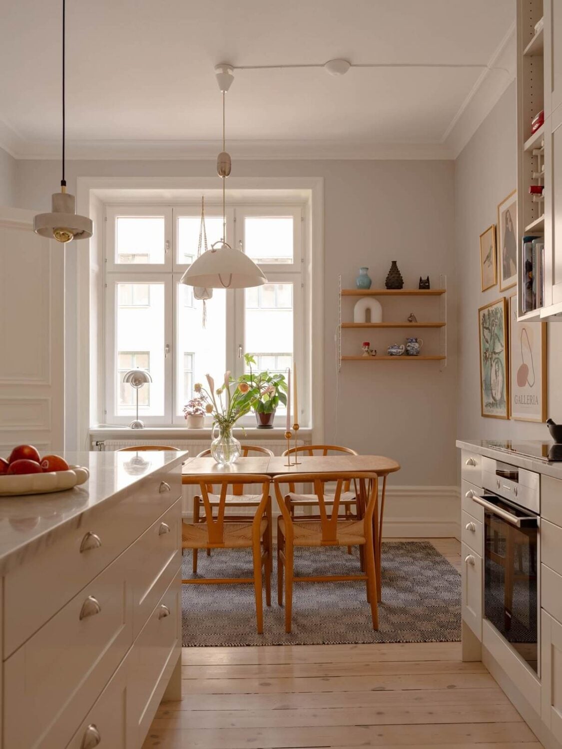 A Spacious Stockholm Apartment with Light Gray Walls 10 light kitchen with large table