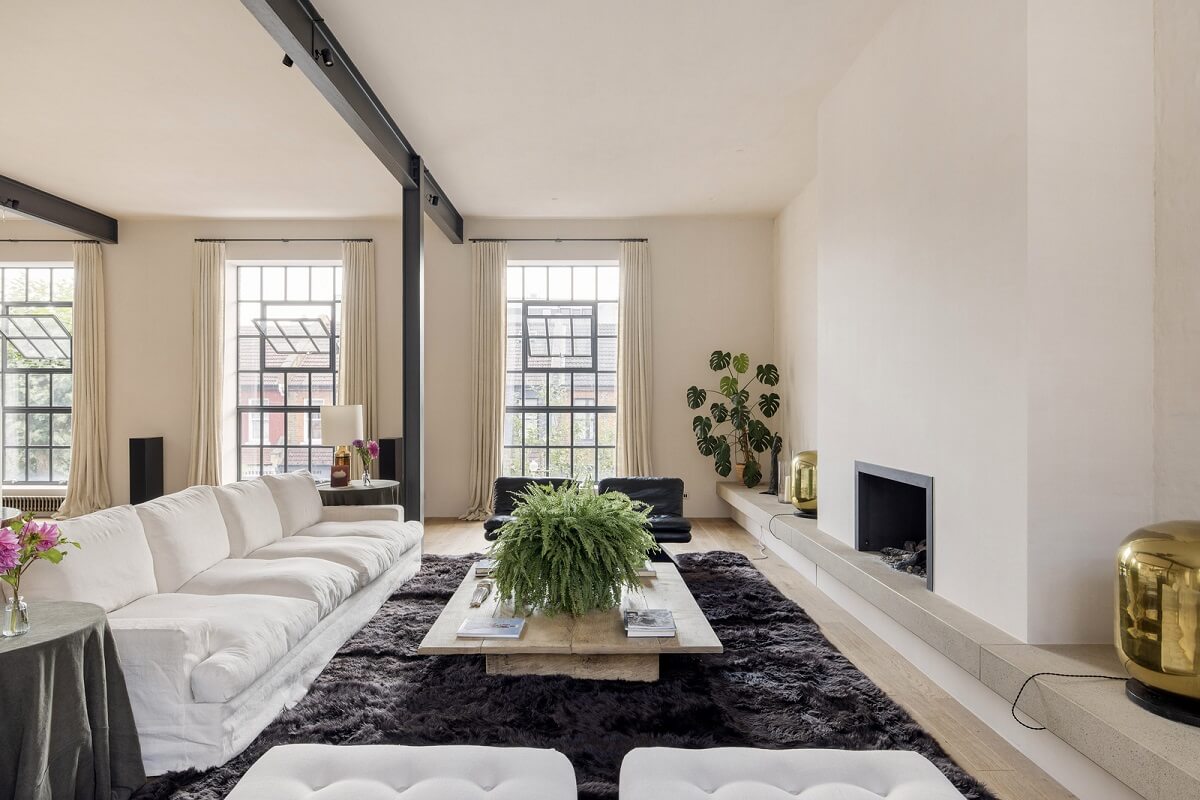 A Grand Industrial Warehouse Conversion in London 17 light living room black rug fireplace