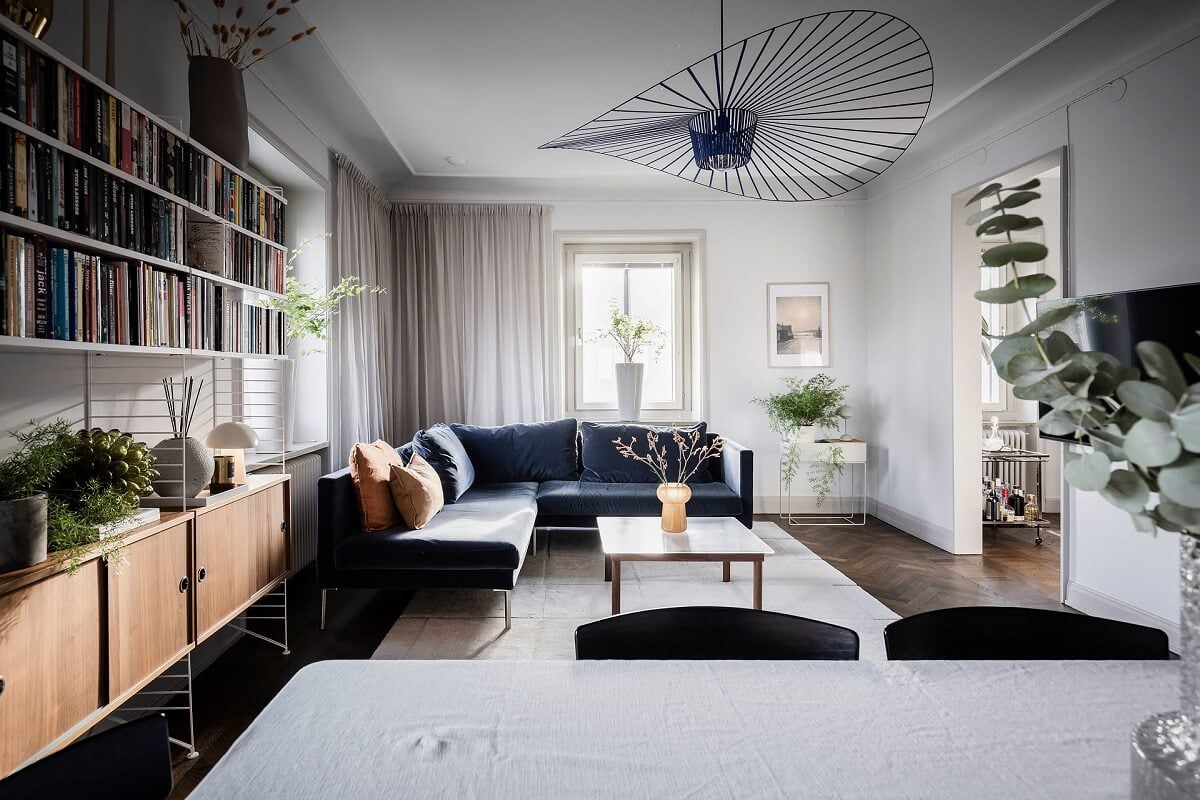 A Burgundy Kitchen in a Stylish Scandinavian Apartment 4 living room blue corner sofa