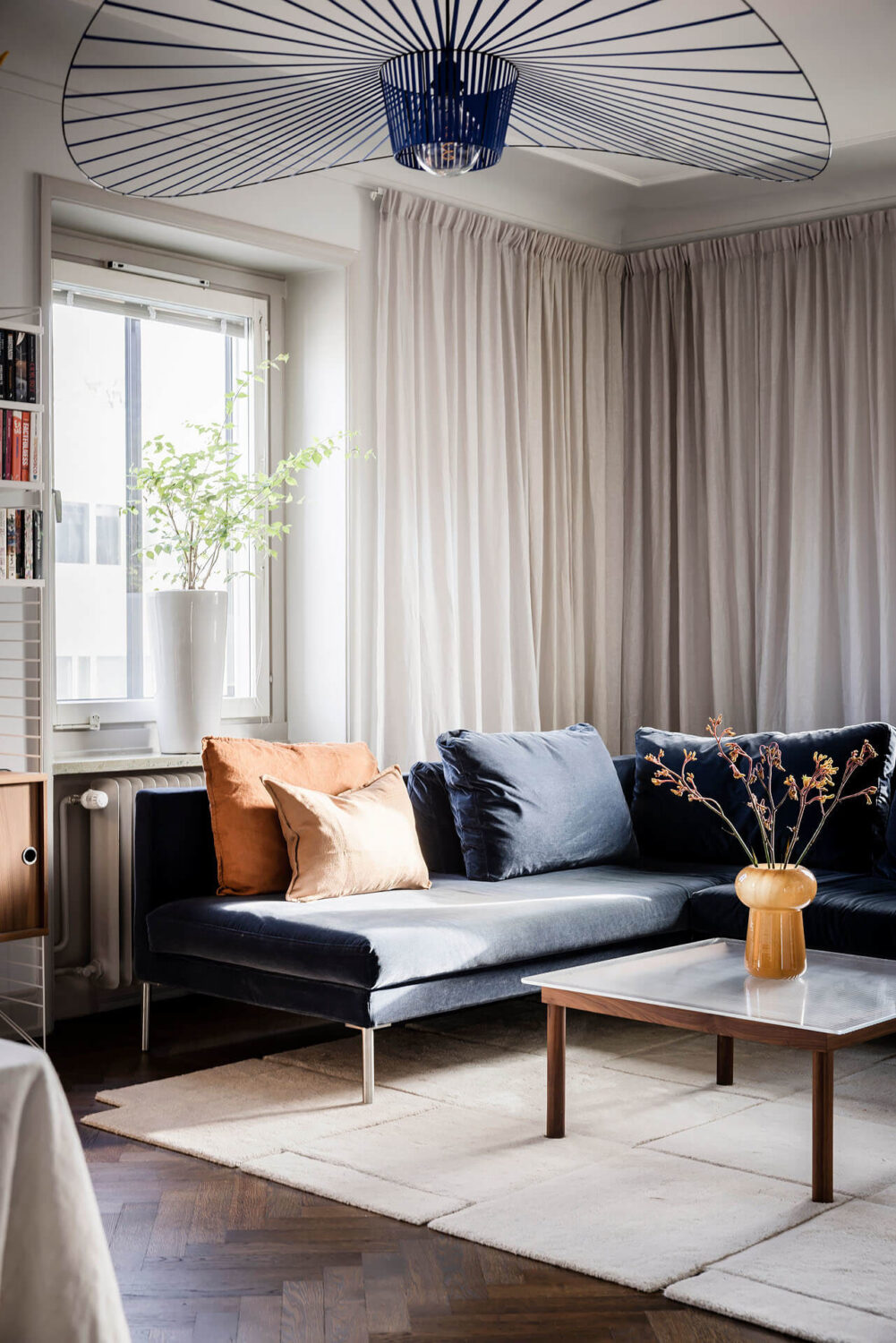 A Burgundy Kitchen in a Stylish Scandinavian Apartment 3 living room detail