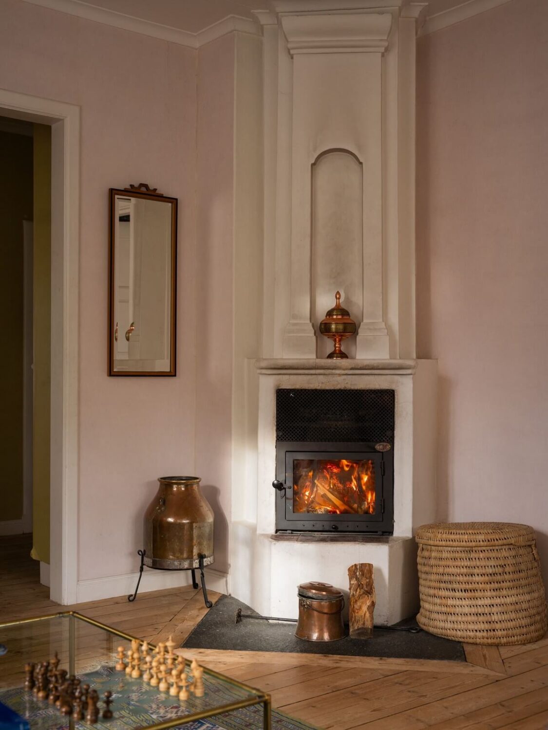 A Romantic 1920s Villa with Views of the Lake 3 living room fireplace light pink walls