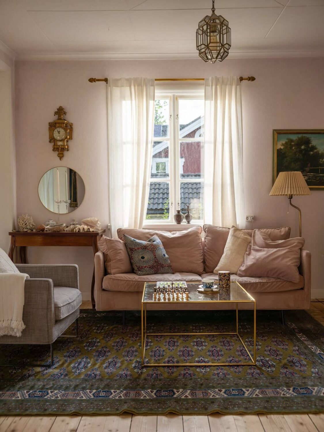 A Romantic 1920s Villa with Views of the Lake 4 living room pink sofa