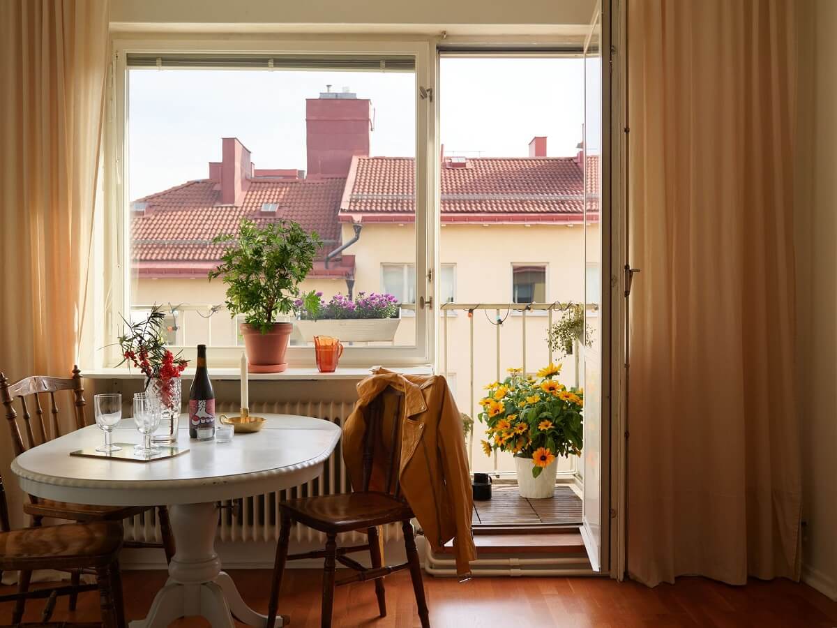A Small 1930s Swedish Apartment with a Yellow Floral Hall 5 living room with balcony