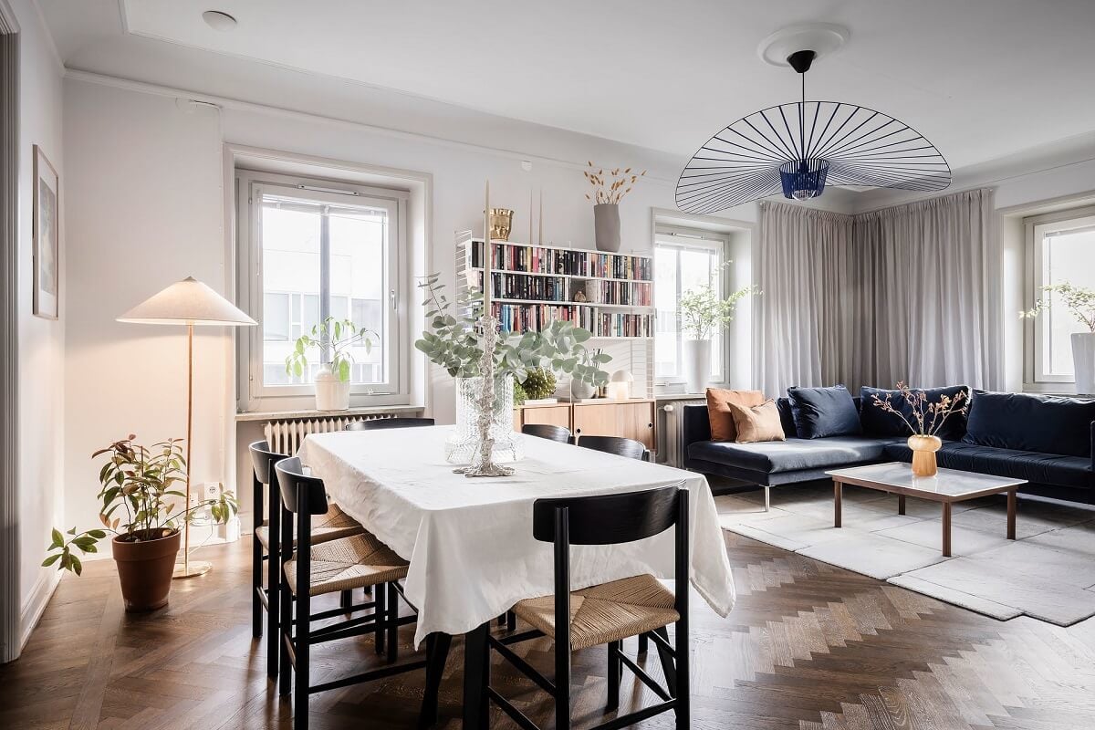 A Burgundy Kitchen in a Stylish Scandinavian Apartment 5 living room with chevron floor and corner sofa