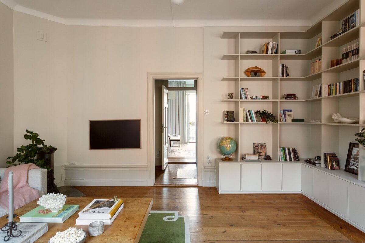 A Turn-of-the-Century Apartment with Warm Open-Plan Spaces 5 living room with corner bookshelves