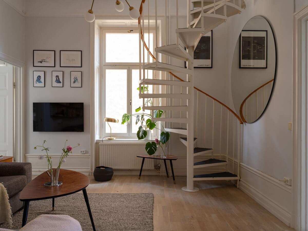 A Swedish Maisonette with Period Features and Modern Solutions 7 living room with spiral staircase