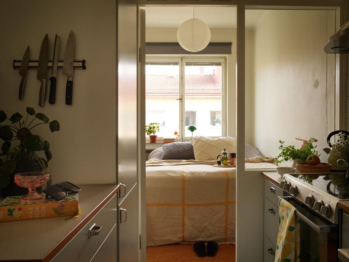 A Small 1930s Swedish Apartment with a Yellow Floral Hall 10 midcentury kitchen with glass door to bedroom
