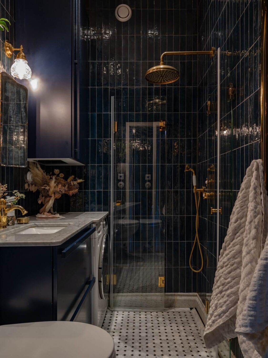 Best of 2025: Bathrooms 24 moody small bathroom with dark blue tiles and brass fittings nordroom