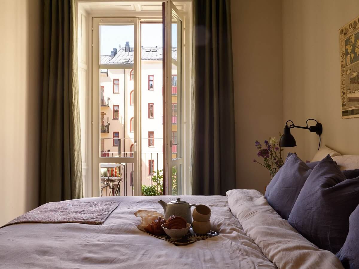 A Light Turn-of-the-Century Apartment with a Cheerful Color Palette 12 muted yellow bedroom walls