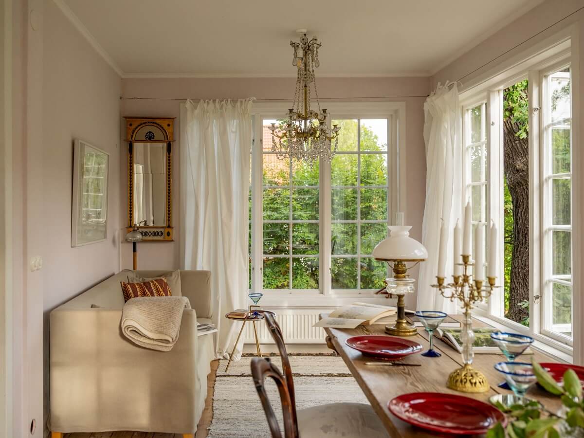 A Romantic 1920s Villa with Views of the Lake 10 open plan living room with large dining table