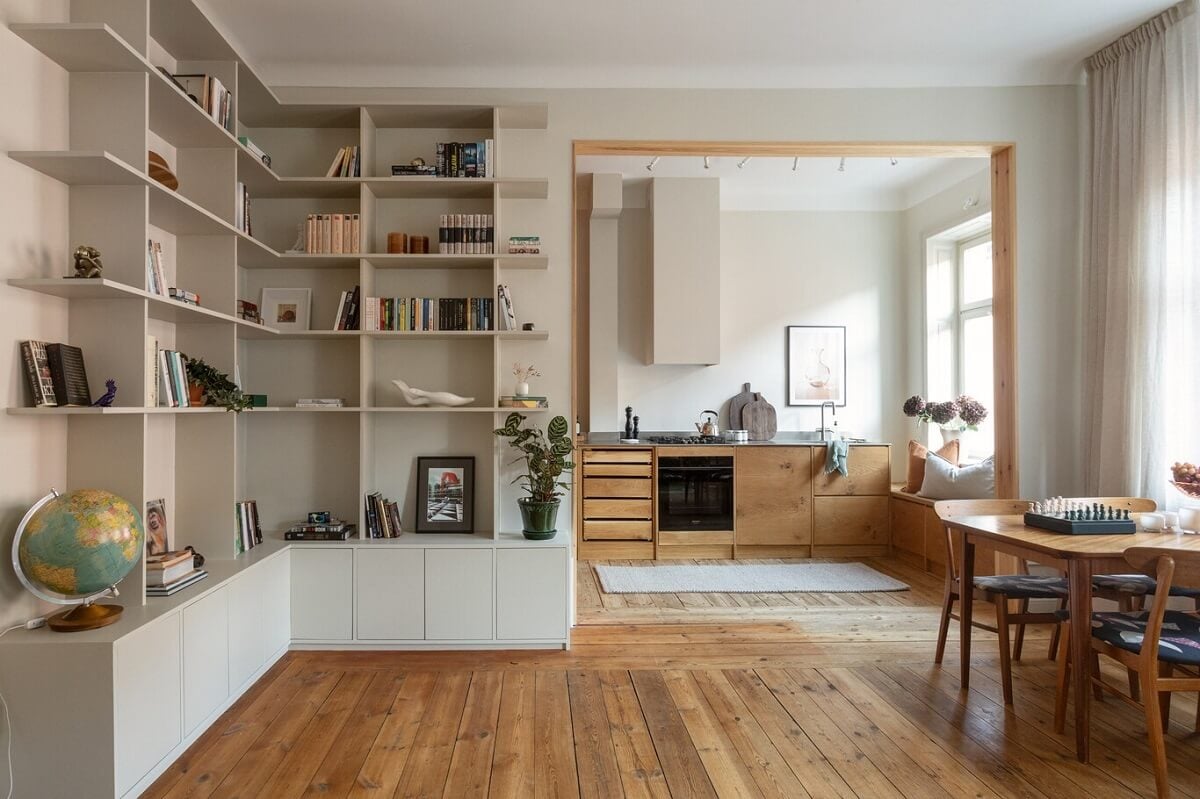 A Turn-of-the-Century Apartment with Warm Open-Plan Spaces 6 open plan living space with corner bookshelves