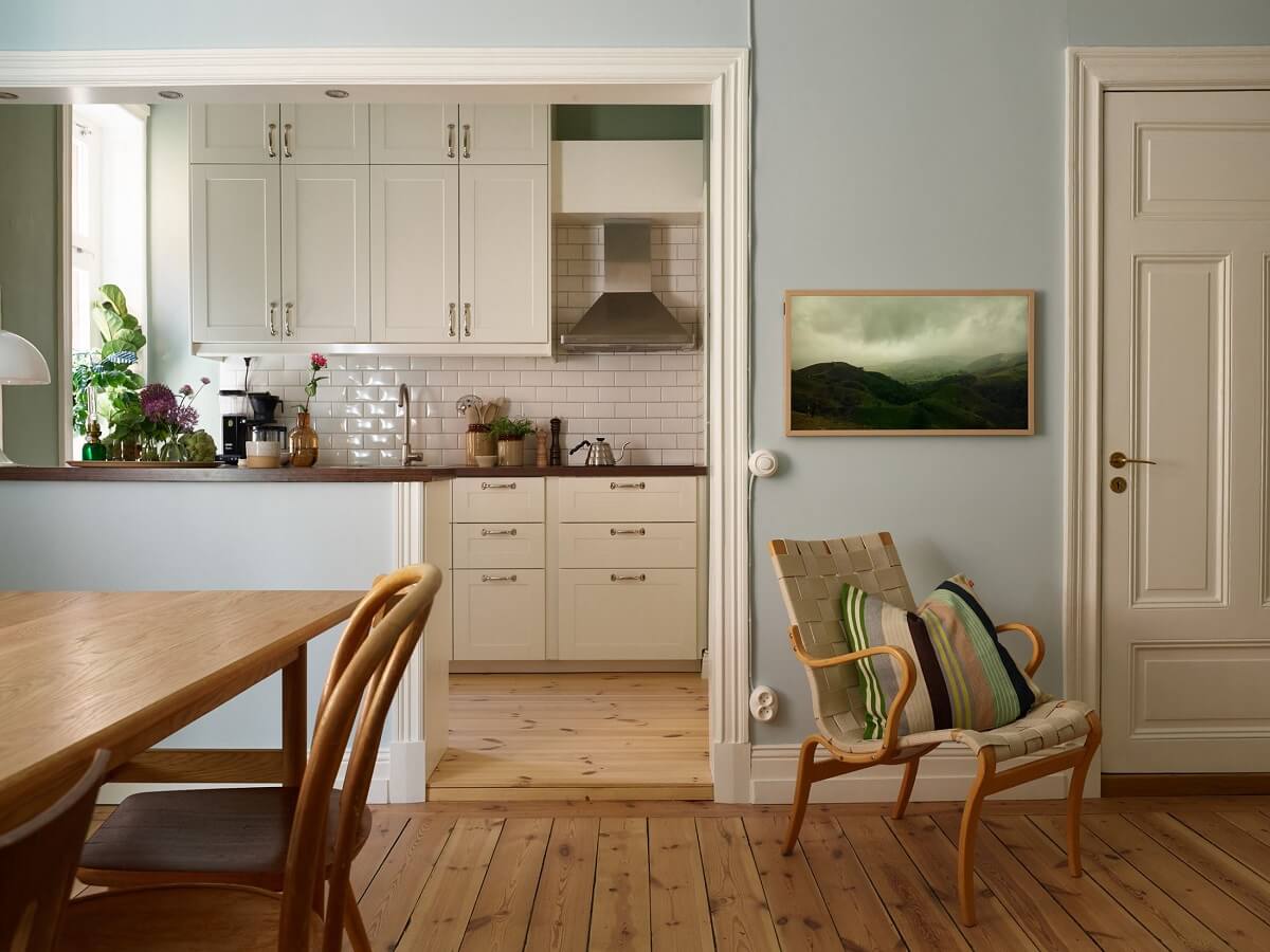 A Light Turn-of-the-Century Apartment with a Cheerful Color Palette 6 open plan living space wooden floorboards