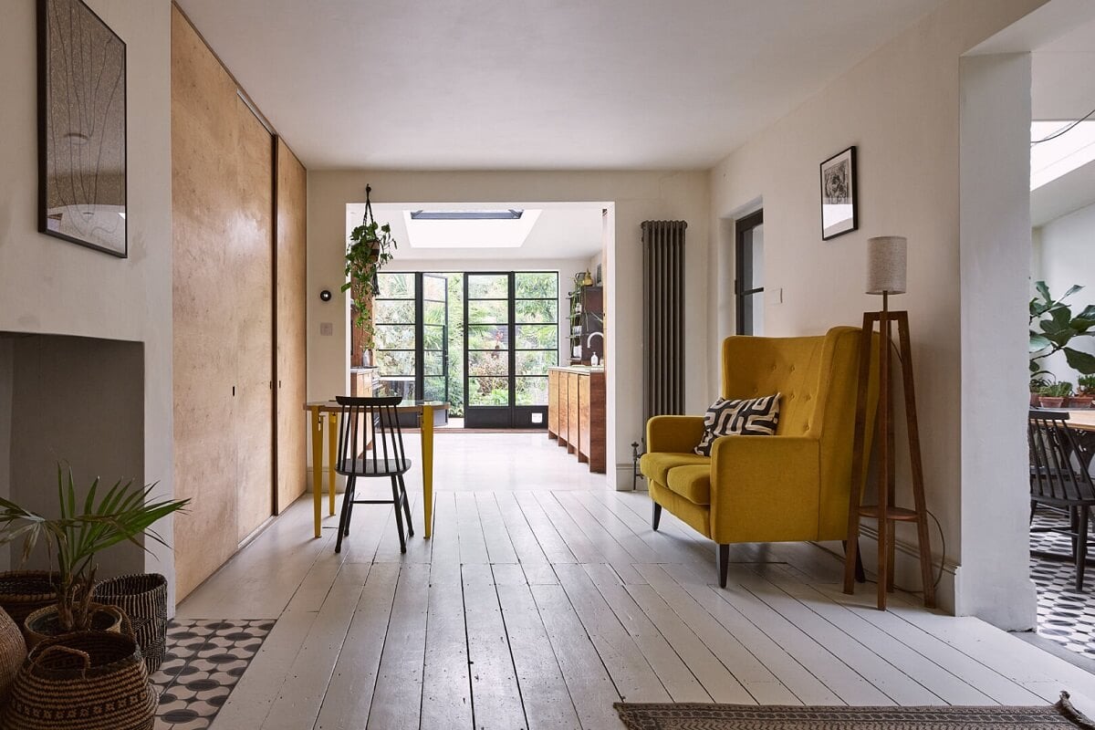 A Grand Victorian House with Many Period Features and a Lush Garden 4 open plan sitting room yellow couch