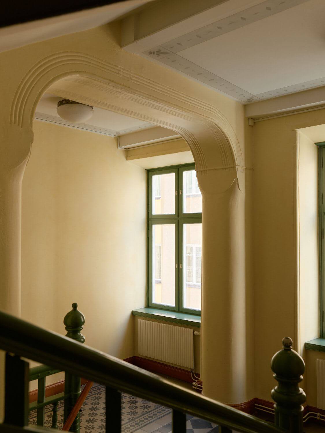 A Light Corner Apartment with 1890s Period Features 25 pale yellow communal staircase A Light Corner Apartment with 1890s Period Features