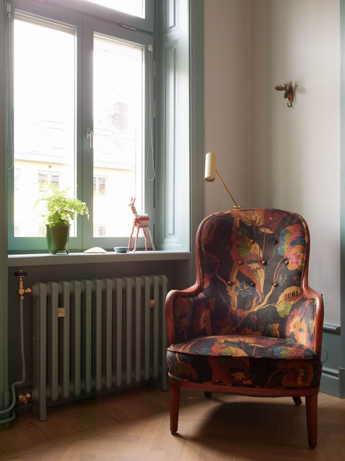 A Colorful Turn-of-the-Century Family Apartment in Stockholm 11 patterned armchair