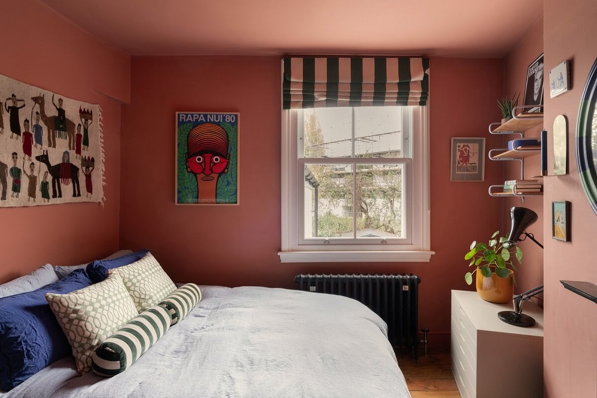 Colorful Rooms and Period Features in a London Terrace House 15 pink color drenched bedroom striped curtain