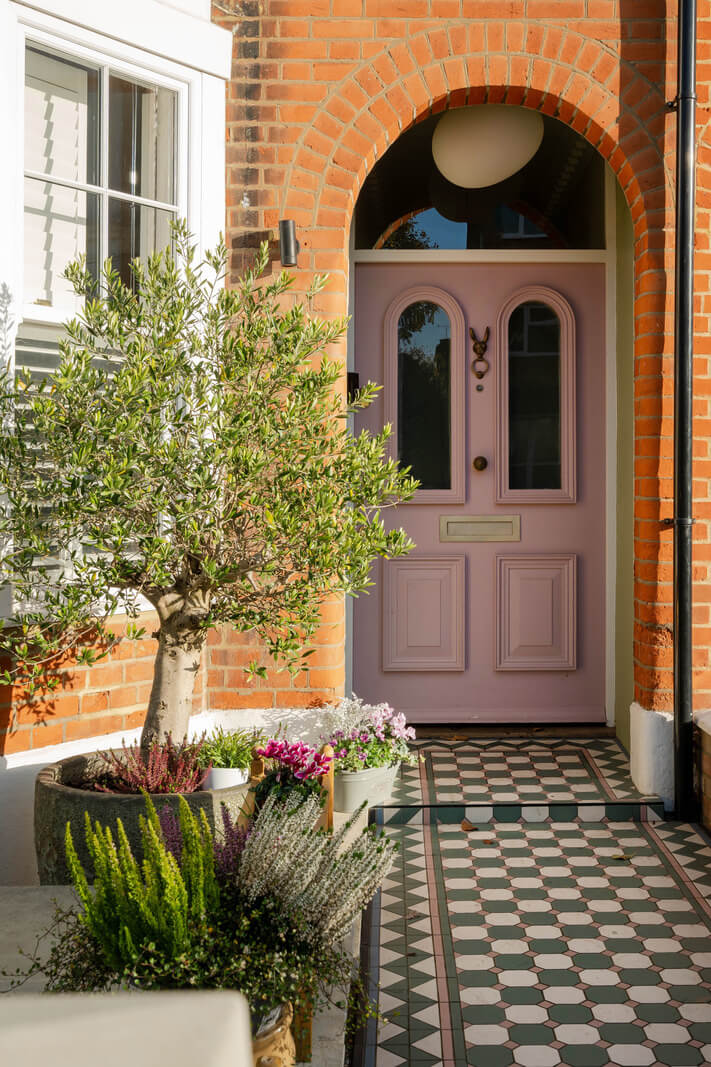 A Colorful Edwardian Family Home in London 23 pink front door and black and white tiles A Colorful Edwardian Family Home in London